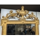 Miroir style Louis XVI fronton urne en bois doré