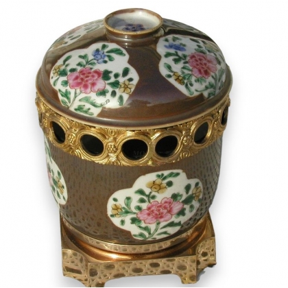 Pot with lid, brown background