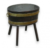 Wine cooler on foor legs,set with brass.