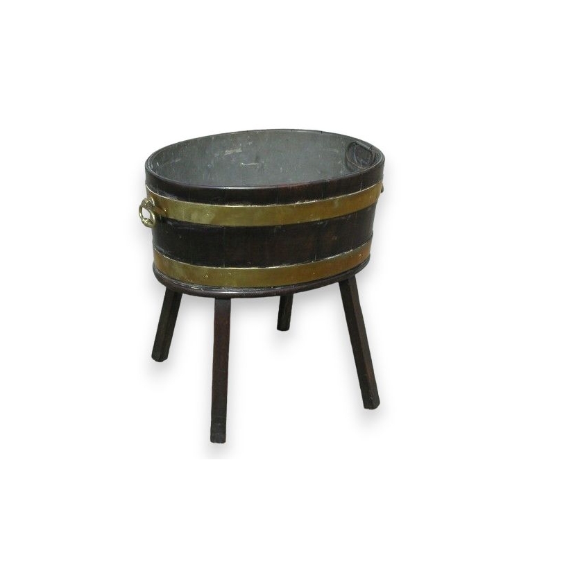 Wine cooler on foor legs,set with brass.