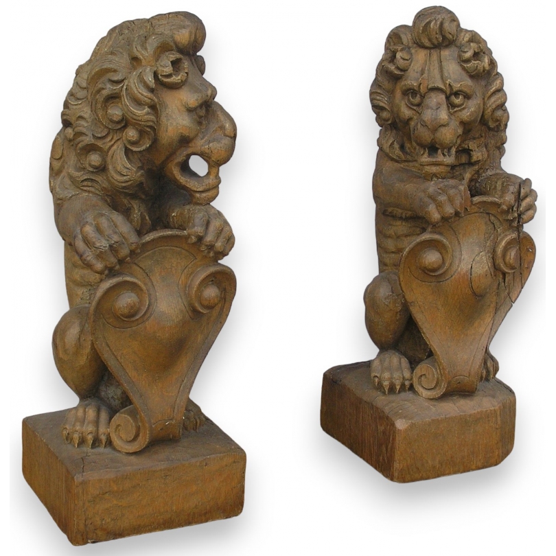 Paire de sculptures "Lions" sur socle,