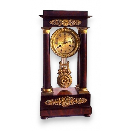 Empire clock mahogany and gilt